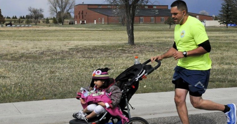 Man running with stroller